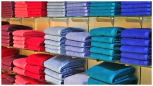 multi-colored towels on shelves