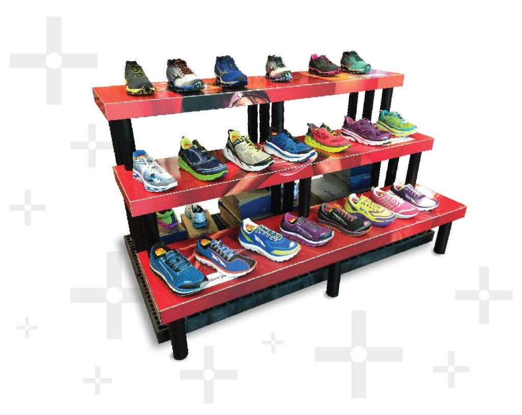 three-tiered plastic display featuring shoes