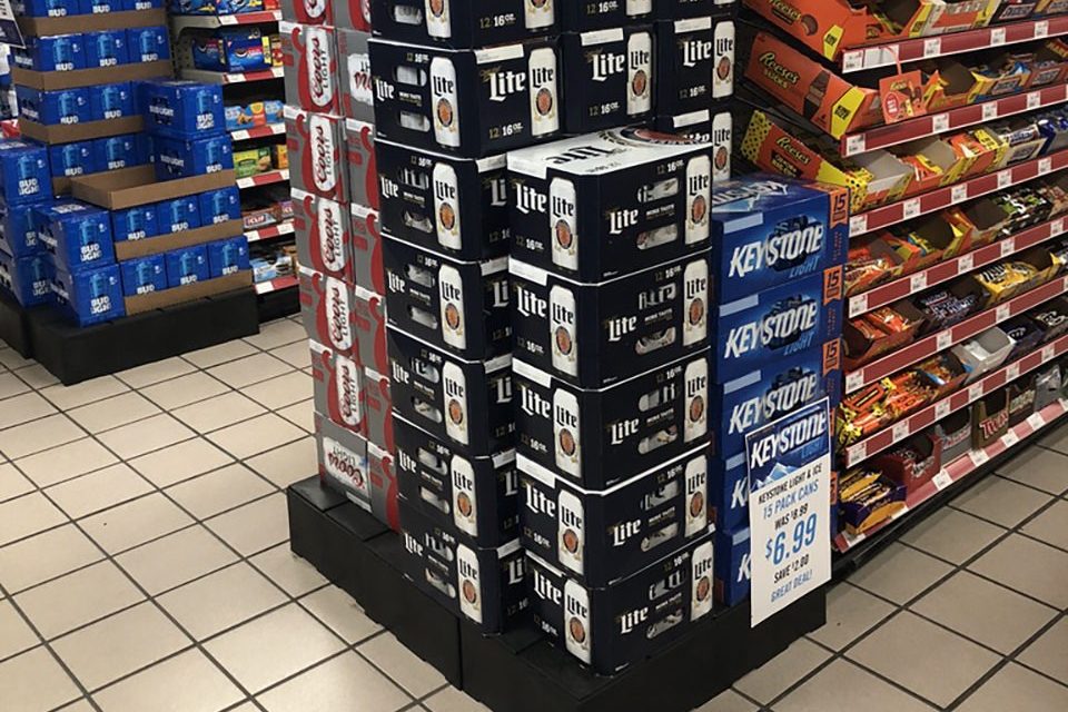 boxes of beer on a plastic display