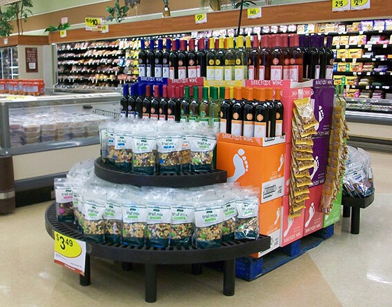 Half round display of trail mix in a grocery store