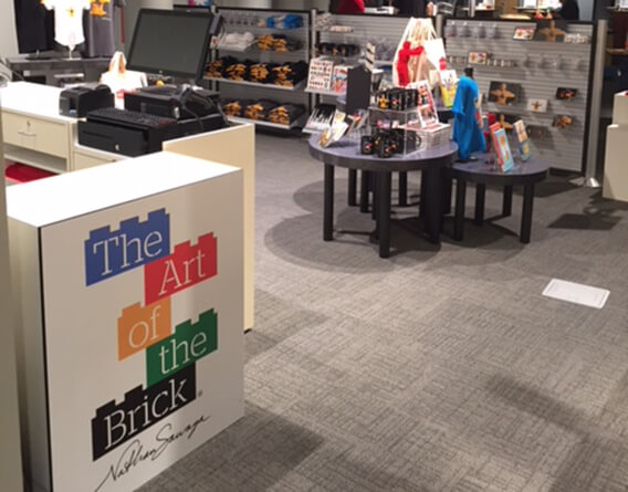 The art of the brick pop up store with products on display