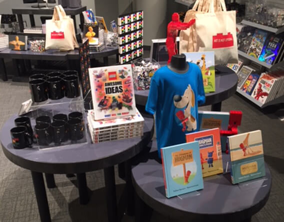 Multiple displays with books, shirts, coffee cups and toys