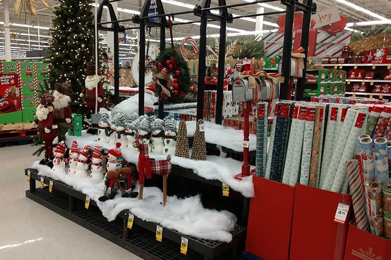 Holiday display with fake snow, snowman and pine trees