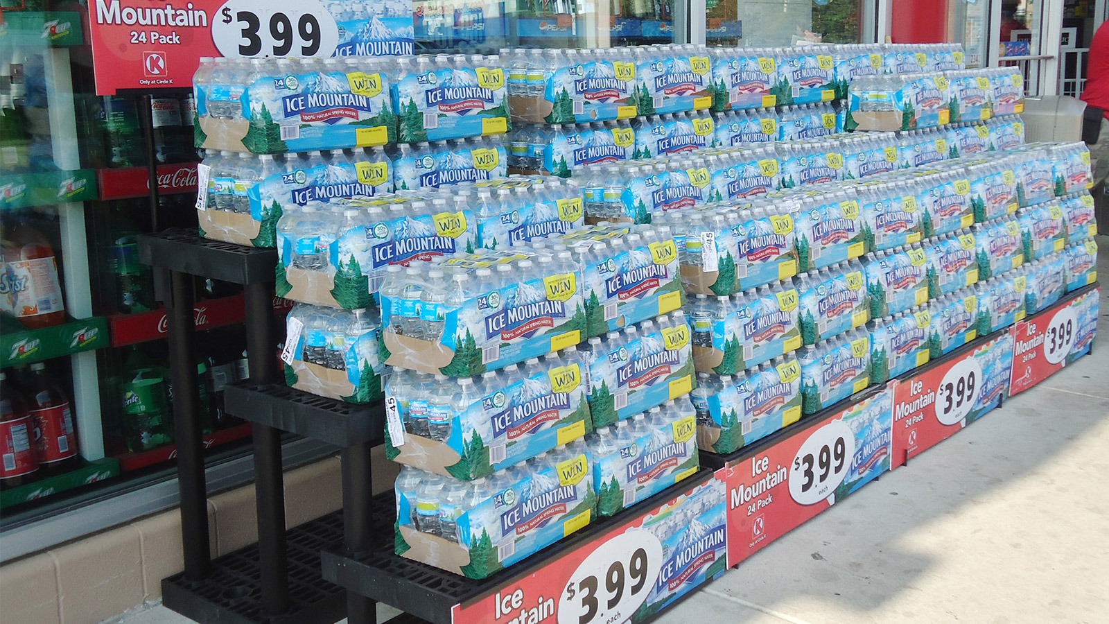 Exterior display with cases of water.