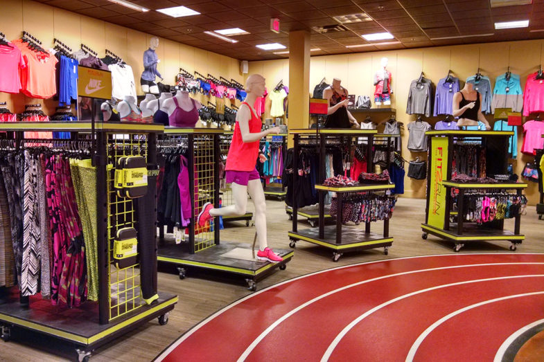 Multiple sportswear displays around an indoor track