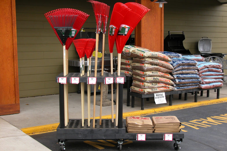 Display of rakes in front of a hardware store